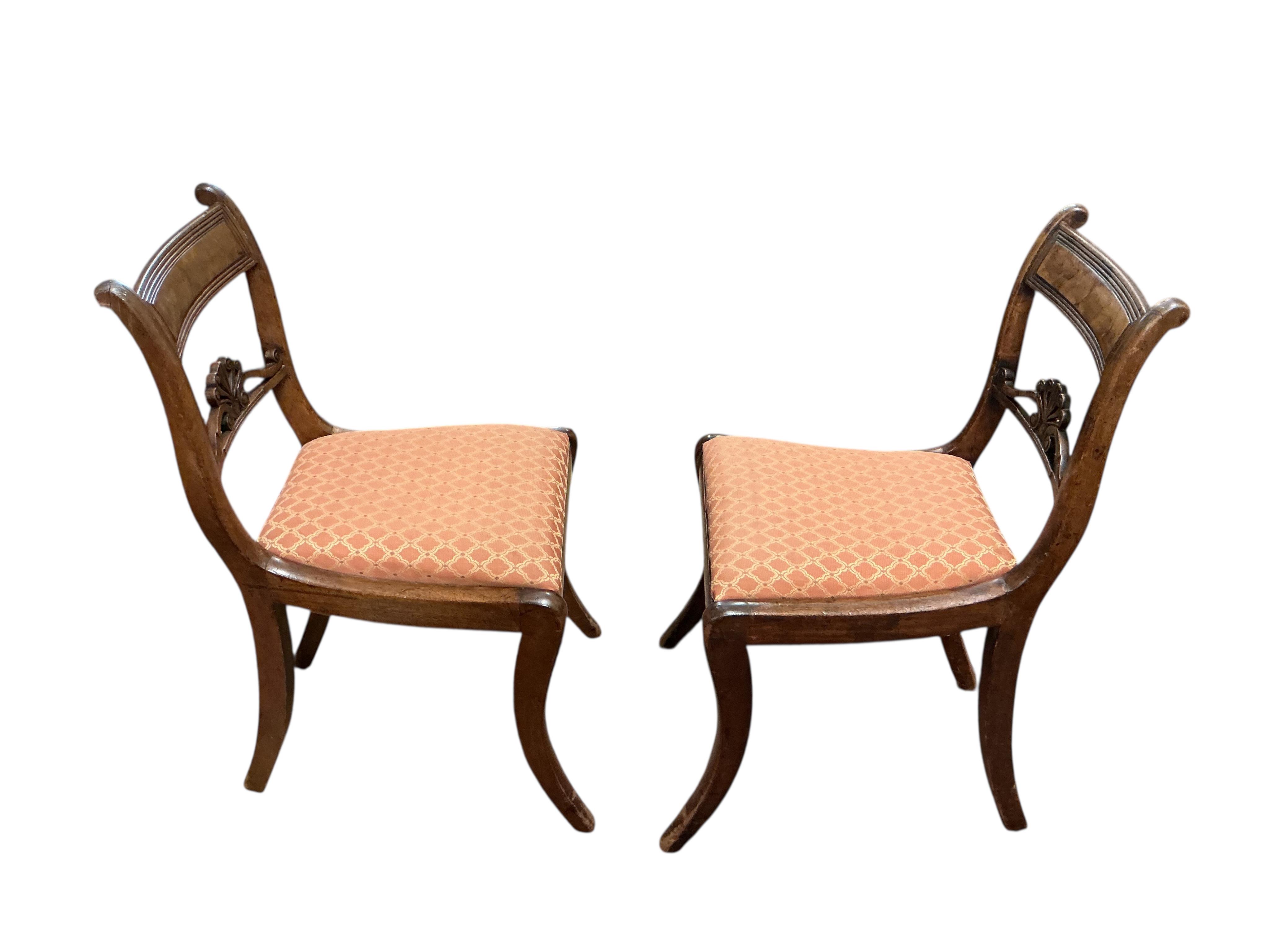 A set of eight Regency mahogany dining chairs, two with arms.